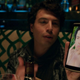 todd holding a picture of himself on his phone